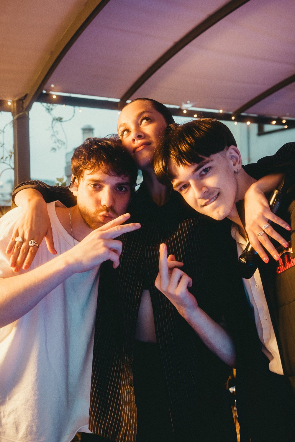 RIIKI REID posing with her live band after the rooftop performance