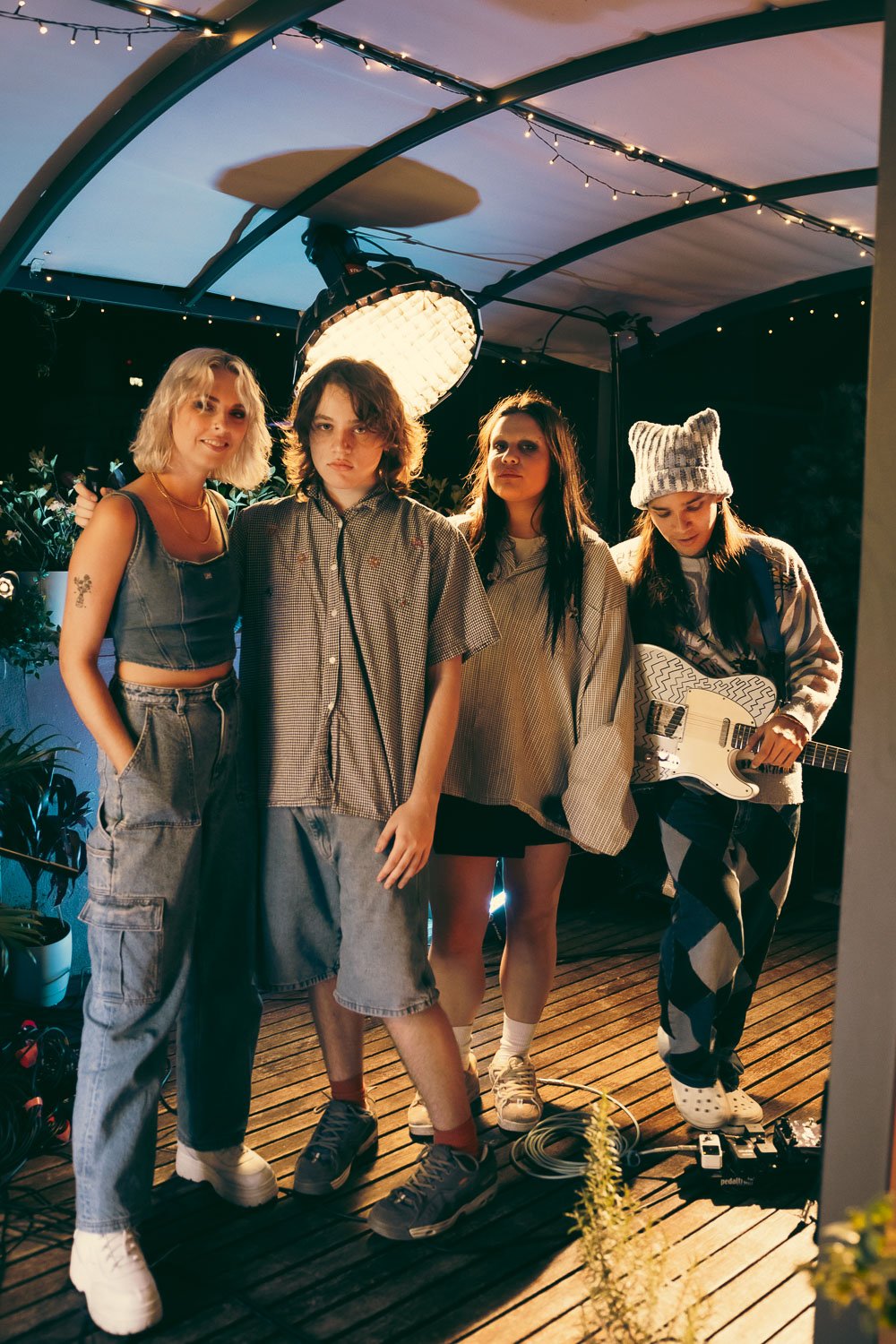 Caroline & Claude stand with their live band after the performance.