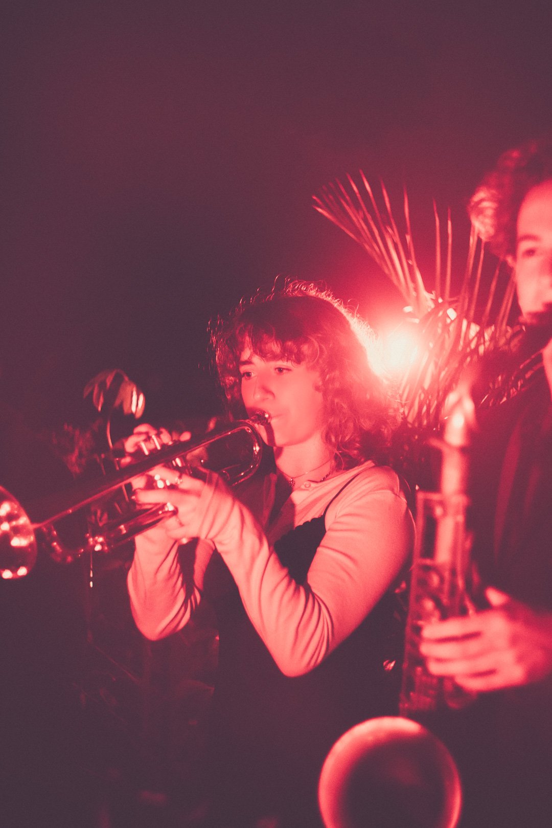 Trumpet player performing alongside Ruby Jackson during live rooftop session.
