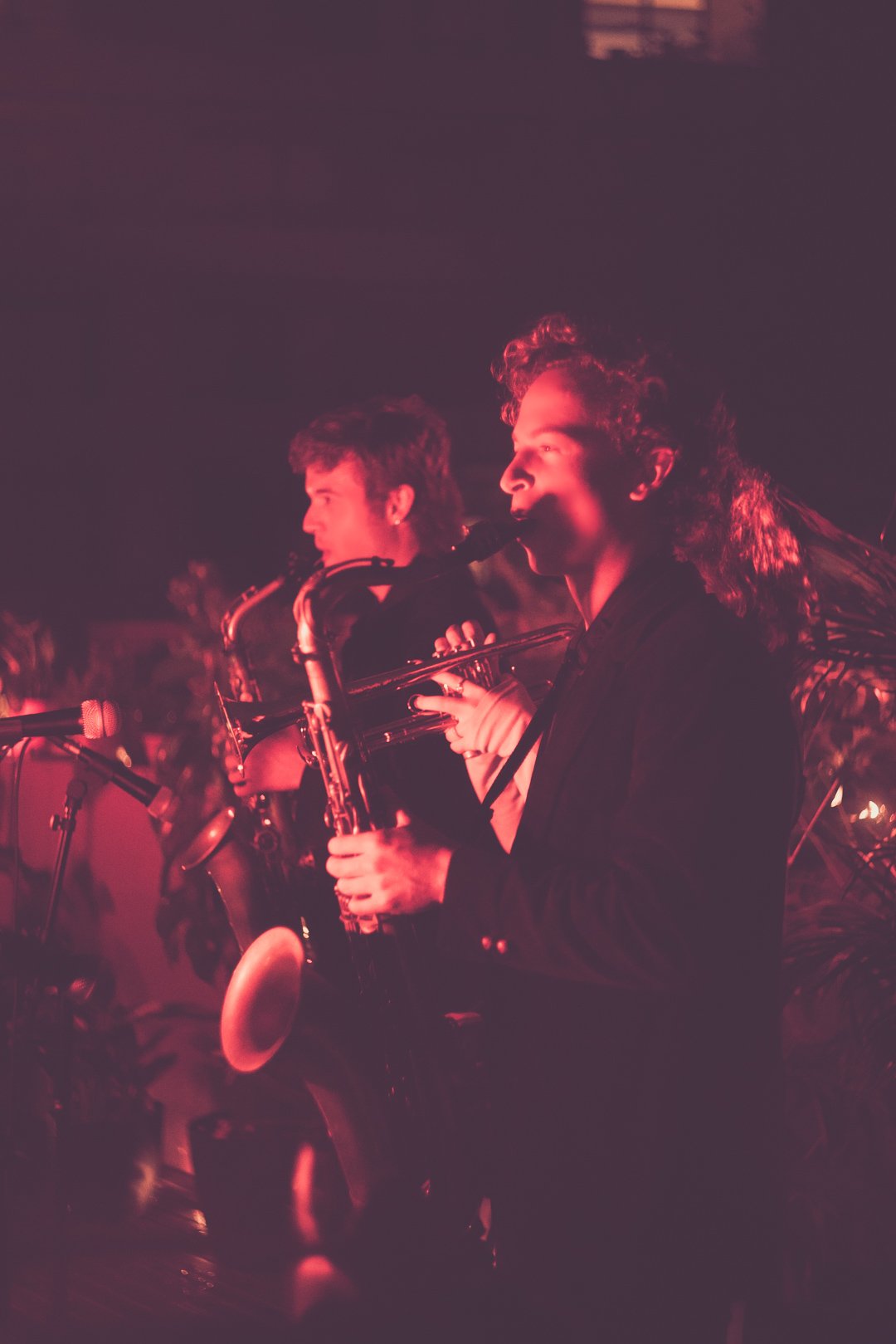 Saxophonist and trumpeter performing together during Ruby Jackson rooftop set.
