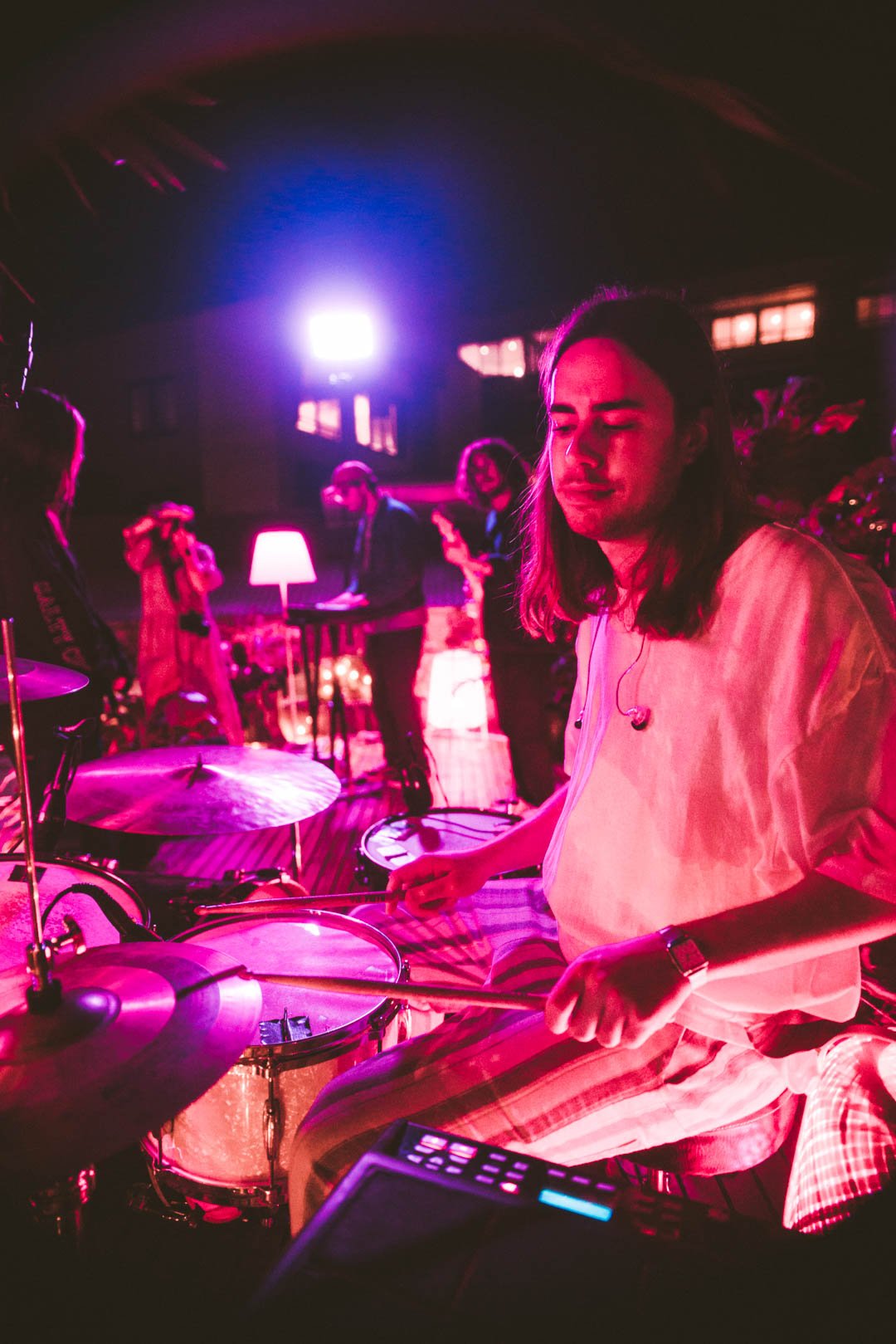 Wide shot of drummer and band performing together on the Mood on the Roof stage.